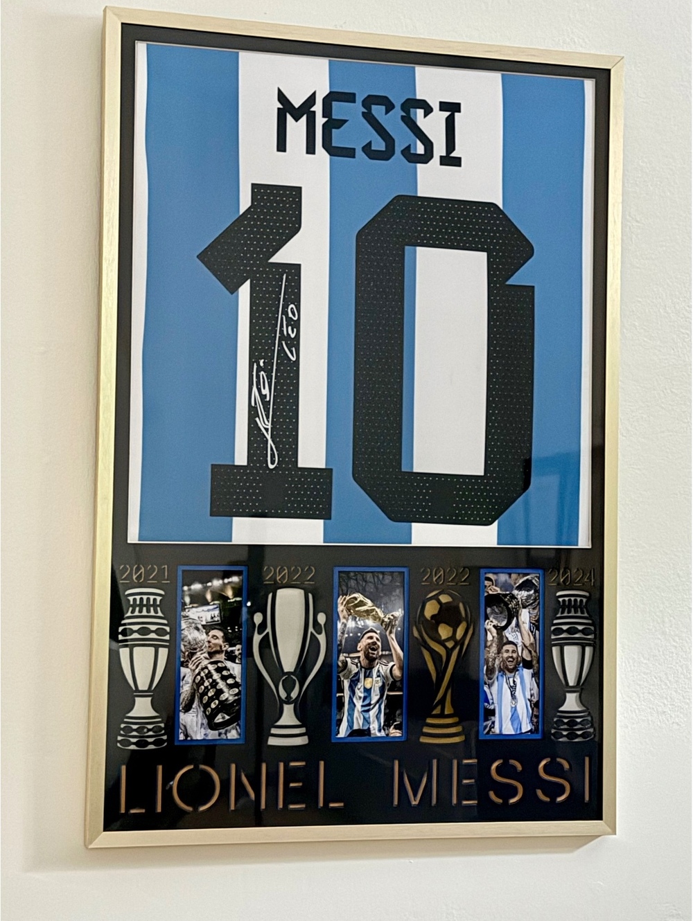 Gracias LEO! Trophies won by Messi w/ Argentina-Framed Jersey–Printed Signature